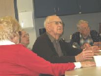 support group sitting around tables talking