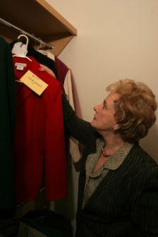 visually impaired woman choosing clothes from her closet