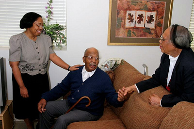 older man with family members