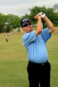 Picture of older golfer with vision loss swing a golf club