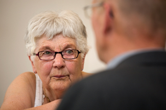 older woman talking to counselor