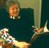 woman reading in an armchair