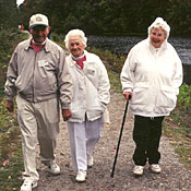 three seniors walking together as part of a walking club