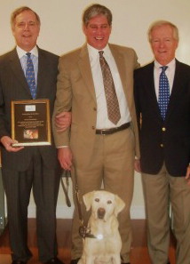 Jeff at donation ceremony at Guiding Eyes for the Blind. Pictured also are John Butler, Verizon's director of community affairs, and William Badger, president of Guiding Eyes.