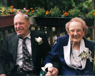 Paul and Dorothy Johnson, sitting on a deck, smiling