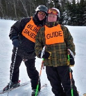 Scott standing on the slopes with his son Mike