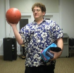 David Block holding a ball, teaching children to play goalball