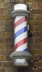 A red, white, and blue striped barber pole