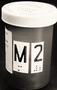 Large print and tactile label on medication container