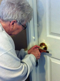 Birdie uses one hand to find her keyhole, and the other hand to guide the key into the hole.