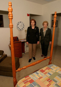 A mother and daughter enter bedroom