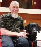 Gil Johnson with Harley his guide dog