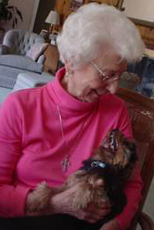 Dr. Elizabeth Cleino, with her dog on her lap