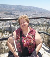 Lora Felty sitting on top of Livivictos Hill