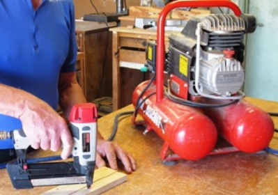 a nail gun with a compressor