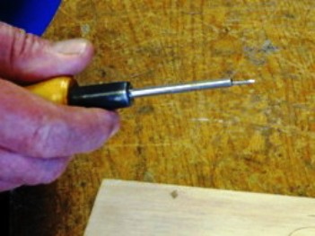 brad starter tool holding a nail
