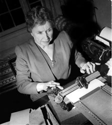 Helen Keller typing on Braille writer