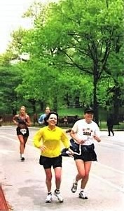 visually impaired runner racing in a marathon with a guide