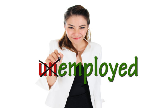 Woman crossing out 'un' in word 'unemployed' to read 'employed.'Change word of unemployed to employed 