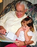 Reading with an illuminated stand magnifier