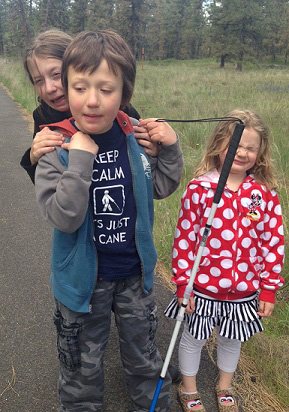 Eddie with both sisters...and a cane mishap