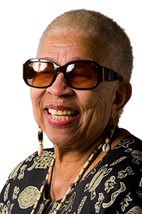 older woman wearing sunglasses, smiling