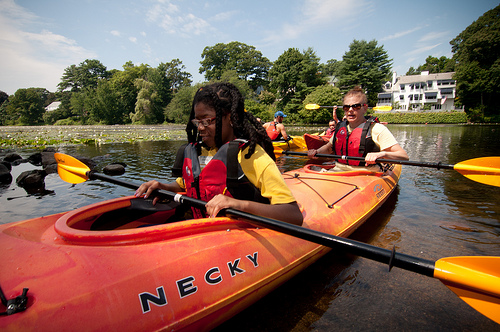 Summer camp girl in kayak