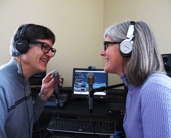 Peter Torpey and Nancy Goodman Torpey sit in their recording studio