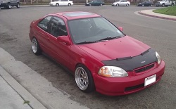 red car parked at curb