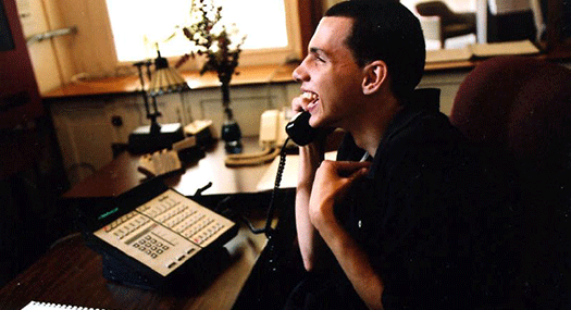 teenaged boy on the phone, smiling widely