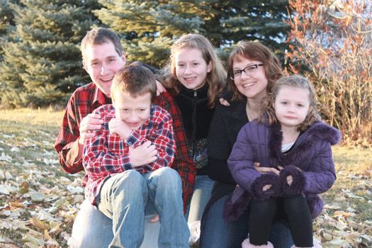 Emily Coleman and her husband and children