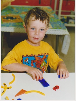 michael playing with tactile shapes