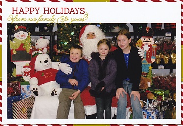 Eddie and sisters sitting with Santa