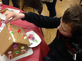 Eddie decorating gingerbread house