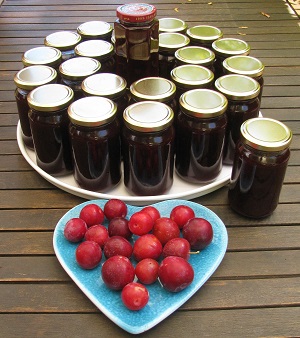 jars of jam and plate of apples