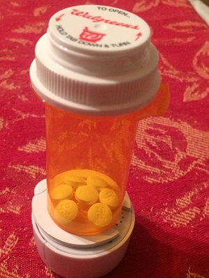 pill reminder bottle with pills 