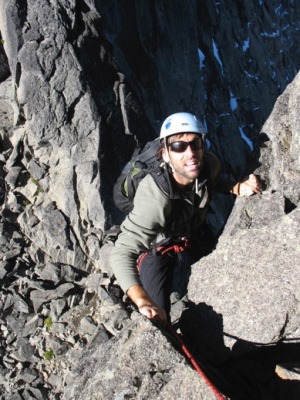 Erik W. rock climbing