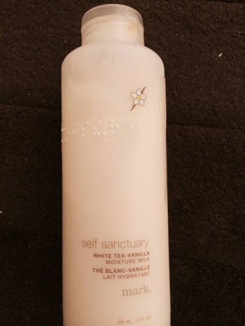 white lotion bottle with braille label