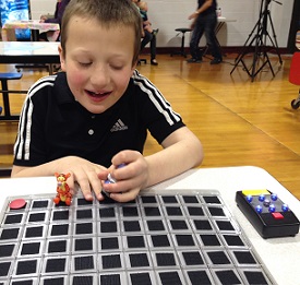 Eddie playing board game smiling