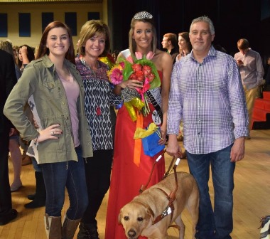 Carly Becknell with family and Brinkley after a pageant