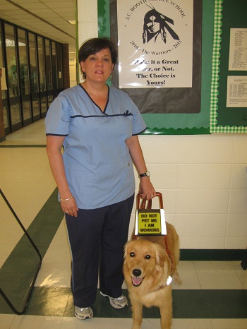 audrey in nursing uniform with her dog guide