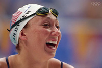 Amy Van Dyken-Rouen at the Olympics, wearing swim cap and goggles