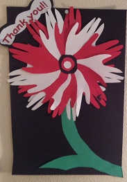 Paper flower made of red and white hand cut-outs