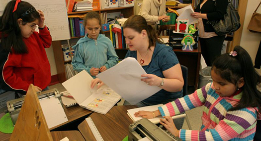 teacher and visually impaired students in a classroom