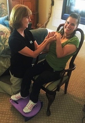 Trina working with a patient