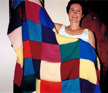 knitted children's blanket with multi-colored squares