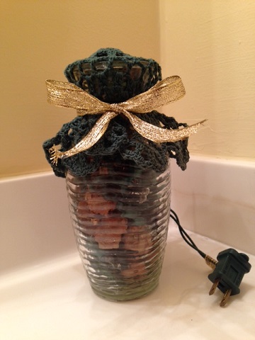 jar with potpourri and lights inside and cord outside to plug into outlet