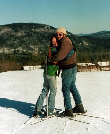 sue and husband hugging on snowy slope