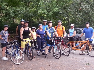 Tuesday Tandem bike club members holding tandem bikes