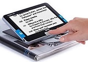 reading a magazine with a digital magnifier